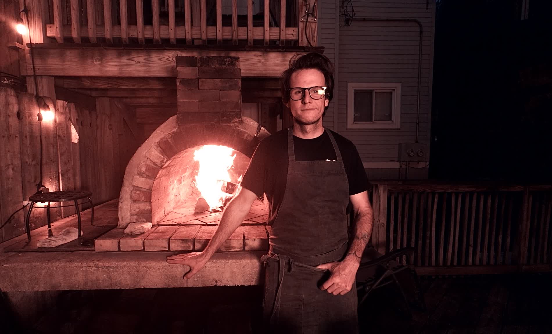 Shawn Clendening at the wood-fired oven